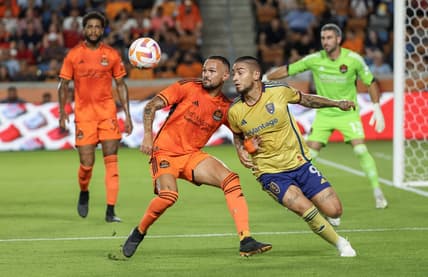 Aug 23, 2023; Houston, TX, USA;Houston Dynamo midfielder Artur (6) and Real Salt Lake forward Christian Chico Arango (9) tie each other up in the first half at Shell Energy Stadium. Mandatory Credit: Thomas Shea-USA TODAY Sports