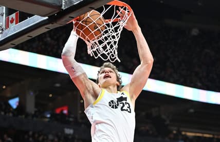 Dec 23, 2023; Toronto, Ontario, CAN;  Utah Jazz forward Lauri Markkanen (23) dunks for a basket against the Toronto Raptors in the second half at Scotiabank Arena. Mandatory Credit: Dan Hamilton-USA TODAY Sports