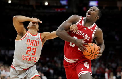 Feb 6, 2024; Columbus, Ohio, USA; Indiana Hoosiers forward Payton Sparks (24) controls the ball as Ohio State Buckeyes forward Zed Key (23) defends during the first half at Value City Arena. Mandatory Credit: Joseph Maiorana-USA TODAY Sports