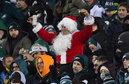 Dec 21, 2021; Philadelphia, Pennsylvania, USA; A Philadelphia Eagles fan dressed as Santa cheers during the fourth quarter against the Washington Football Team at Lincoln Financial Field. Mandatory Credit: Eric Hartline-USA TODAY Sports