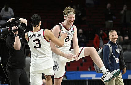 Mar 19, 2022; Portland, OR, USA; Gonzaga Bulldogs forward Drew Timme (2) and Gonzaga Bulldogs guard Andrew Nembhard (3) celebrate the win against Memphis Tigers 78-82 in the second round of the 2022 NCAA Tournament at Moda Center. Mandatory Credit: Troy Wayrynen-USA TODAY Sports