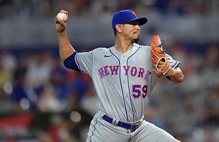 Jul 30, 2022; Miami, Florida, USA; New York Mets starting pitcher Carlos Carrasco (59) delivers against the Miami Marlins in the first inning at loanDepot Park. Mandatory Credit: Jim Rassol-USA TODAY Sports.