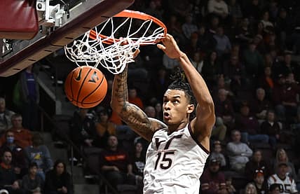 Nov 25, 2022; Blacksburg, Virginia, USA;Virginia Tech Hokies center Lynn Kidd (15) dunks in the second half against the Charleston Southern Buccaneers at Cassell Coliseum. Mandatory Credit: Lee Luther Jr.-USA TODAY Sports