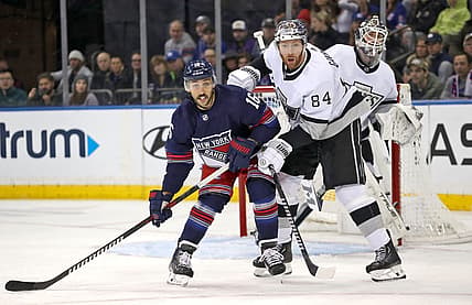 Dec 10, 2023; New York, New York, USA; New York Rangers center Vincent Trocheck (16) and Los Angeles Kings defenseman Vladislav Gavrikov (84) battle for position in front of Los Angeles Kings goalie Pheonix Copley (29) during the first period at Madison Square Garden. Mandatory Credit: Danny Wild-USA TODAY Sports