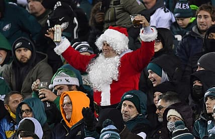 Dec 21, 2021; Philadelphia, Pennsylvania, USA; A Philadelphia Eagles fan dressed as Santa cheers during the fourth quarter against the Washington Football Team at Lincoln Financial Field. Mandatory Credit: Eric Hartline-USA TODAY Sports