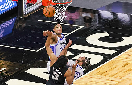 Apr 12, 2021; Orlando, Florida, USA; Orlando Magic forward Chuma Okeke (3) blocks a shot by San Antonio Spurs forward Keldon Johnson (3) as Orlando Magic guard Michael Carter-Williams (7) looks on during the first quarter at Amway Center. Mandatory Credit: Mike Watters-USA TODAY Sports