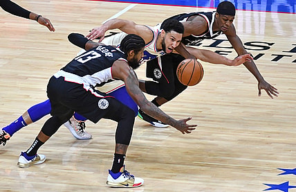 Apr 16, 2021; Philadelphia, Pennsylvania, USA; Philadelphia 76ers guard Ben Simmons (25) dives for loose ball with LA Clippers guard Paul George (13) and guard Rajon Rondo (4) during the second quarter at Wells Fargo Center. Mandatory Credit: Eric Hartline-USA TODAY Sports