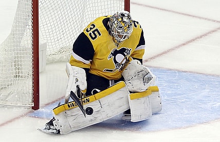 Apr 25, 2021; Pittsburgh, Pennsylvania, USA; Pittsburgh Penguins goaltender Tristan Jarry (35) makes a save against the Boston Bruins during the first period at PPG Paints Arena. Mandatory Credit: Charles LeClaire-USA TODAY Sports