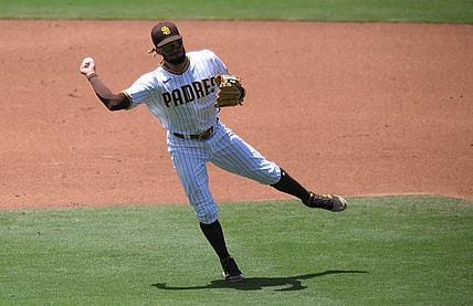 Jun 9, 2021; San Diego, California, USA; San Diego Padres shortstop Fernando Tatis Jr. (23) throws to first base on a ground out Chicago Cubs catcher P.J. Higgins (not pictured) during the third inning at Petco Park. Mandatory Credit: Orlando Ramirez-USA TODAY Sports