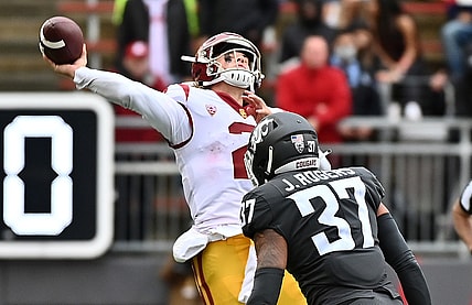 Sep 18, 2021; Pullman, Washington, USA; USC Trojans quarterback Jaxson Dart (2) throws the ball up before Washington State Cougars linebacker Justus Rogers (37) can get to him in the second half at Gesa Field at Martin Stadium. The Trojans won 45-14. Mandatory Credit: James Snook-USA TODAY Sports