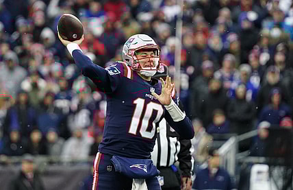 Nov 28, 2021; Foxborough, Massachusetts, USA; New England Patriots quarterback Mac Jones (10) throws a pass against the Tennessee Titans in the second quarter at Gillette Stadium. Mandatory Credit: David Butler II-USA TODAY Sports
