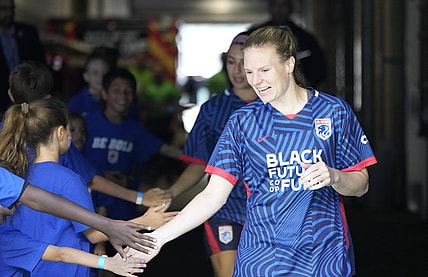 Jul 1, 2023; Seattle, Washington, USA;  OL Reign forward Veronica Latsko (24) greets fans as she walks to the field before playing against Racing Louisville FC in a NWSL game at Lumen Field. Mandatory Credit: Stephen Brashear-USA TODAY Sports