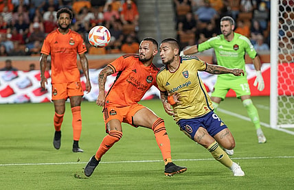 Aug 23, 2023; Houston, TX, USA;Houston Dynamo midfielder Artur (6) and Real Salt Lake forward Christian Chico Arango (9) tie each other up in the first half at Shell Energy Stadium. Mandatory Credit: Thomas Shea-USA TODAY Sports