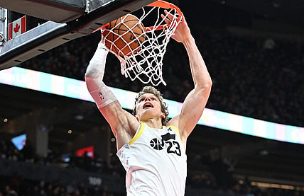 Dec 23, 2023; Toronto, Ontario, CAN;  Utah Jazz forward Lauri Markkanen (23) dunks for a basket against the Toronto Raptors in the second half at Scotiabank Arena. Mandatory Credit: Dan Hamilton-USA TODAY Sports