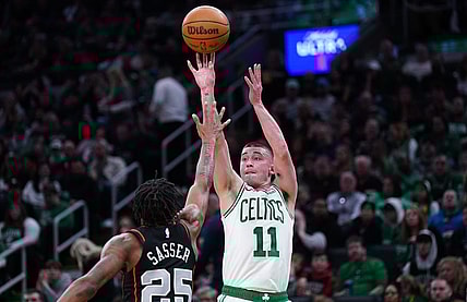 Mar 18, 2024; Boston, Massachusetts, USA; Boston Celtics guard Payton Pritchard (11) shoots the ball against Detroit Pistons guard Marcus Sasser (25) in the second quarter at TD Garden. Mandatory Credit: David Butler II-USA TODAY Sports