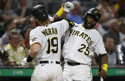 Aug 26, 2021; Pittsburgh, Pennsylvania, USA;  Pittsburgh Pirates first baseman Colin Moran (19) celebrates with right fielder Gregory Polanco (25) after hitting a two run home run against the St. Louis Cardinals during the third inning at PNC Park. Mandatory Credit: Charles LeClaire-USA TODAY Sports