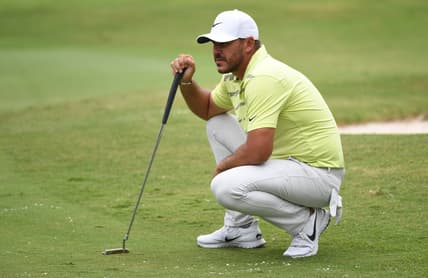 Aug 6, 2021; Memphis, Tennessee, USA; Brooks Koepka waits to putt on the fifth hole during the second round of the WGC FedEx St. Jude Invitational golf tournament at TPC Southwind. Mandatory Credit: Christopher Hanewinckel-USA TODAY Sports