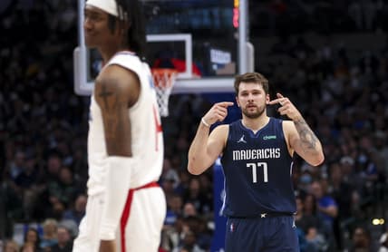 Feb 10, 2022; Dallas, Texas, USA;  Dallas Mavericks guard Luka Doncic (77) gestures to LA Clippers guard Terance Mann (14) during the second half at American Airlines Center. Mandatory Credit: Kevin Jairaj-USA TODAY Sports