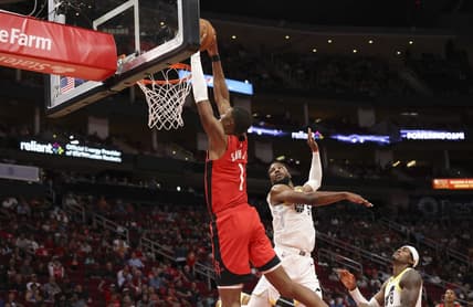 Oct 24, 2022; Houston, Texas, USA; Houston Rockets forward Jabari Smith Jr. (1) dunks against Utah Jazz guard Malik Beasley (5) in the second half at Toyota Center. Mandatory Credit: Thomas Shea-USA TODAY Sports
