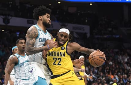 Nov 16, 2022; Charlotte, North Carolina, USA; Indiana Pacers forward Isaiah Jackson (22) drives on Charlotte Hornets center Nick Richards (4) during the first half at the Spectrum Center. Mandatory Credit: Sam Sharpe-USA TODAY Sports