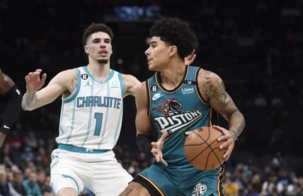 Dec 14, 2022; Charlotte, North Carolina, USA; Detroit Pistons guard Killian Hayes (7) looks to shoot as he is defended by Charlotte Hornets guard LaMelo Ball (1) during the first half at the Spectrum Center. Mandatory Credit: Sam Sharpe-USA TODAY Sports