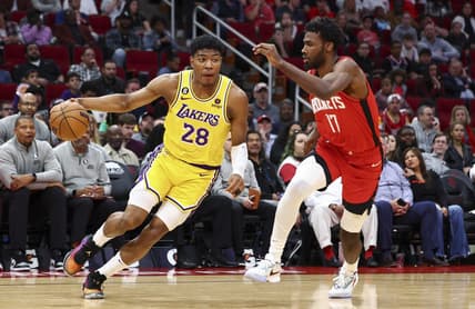 Mar 15, 2023; Houston, Texas, USA; Los Angeles Lakers forward Rui Hachimura (28) dribbles the ball as Houston Rockets forward Tari Eason (17) defends during the third quarter at Toyota Center. Mandatory Credit: Troy Taormina-USA TODAY Sports