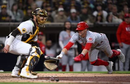 May 2, 2023; San Diego, California, USA; Cincinnati Reds center fielder TJ Friedl (right) scores a run ahead of the throw to San Diego Padres catcher Austin Nola (left) during the eighth inning at Petco Park. Mandatory Credit: Orlando Ramirez-USA TODAY Sports
