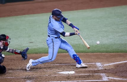 Jun 16, 2023; Arlington, Texas, USA; Toronto Blue Jays catcher Danny Jansen (9) hits a two-run home run during the fifth inning against the Texas Rangers at Globe Life Field. Mandatory Credit: Kevin Jairaj-USA TODAY Sports