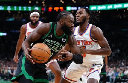 Nov 13, 2023; Boston, Massachusetts, USA; Boston Celtics guard Jaylen Brown (7) drives the ball against New York Knicks guard Immanuel Quickley (5) in the first quarter at TD Garden. Mandatory Credit: David Butler II-USA TODAY Sports