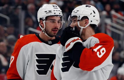 Feb 25, 2024; Pittsburgh, Pennsylvania, USA;  Philadelphia Flyers left wing Noah Cates (27) and right wing Garnet Hathaway (19) talk before a face-off against the Pittsburgh Penguins during the first period at PPG Paints Arena. Mandatory Credit: Charles LeClaire-USA TODAY Sports