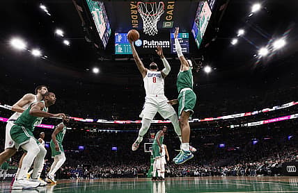 Dec 29, 2021; Boston, Massachusetts, USA; LA Clippers forward Marcus Morris Sr. (8) goes to the basket against Boston Celtics guard Romeo Langford (9) during the second quarter at TD Garden. Mandatory Credit: Winslow Townson-USA TODAY Sports
