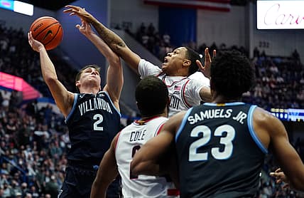 Feb 22, 2022; Hartford, Connecticut, USA; Villanova Wildcats guard Collin Gillespie (2) shoots against Connecticut Huskies guard Jordan Hawkins (24) in the second half at XL Center. Mandatory Credit: David Butler II-USA TODAY Sports