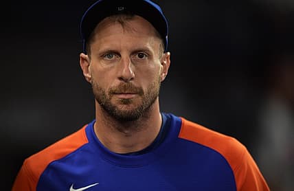 Jun 25, 2022; Miami, Florida, USA; New York Mets pitcher Max Scherzer walks along the dugout during the game against the Miami Marlins at loanDepot Park. Mandatory Credit: Jim Rassol-USA TODAY Sports