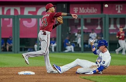 Aug 24, 2022; Kansas City, Missouri, USA; Arizona Diamondbacks shortstop Sergio Alcantara (43) gets the force out on Kansas City Royals right fielder Drew Waters (6) and throws to first base in the third inning at Kauffman Stadium. Mandatory Credit: Denny Medley-USA TODAY Sports
