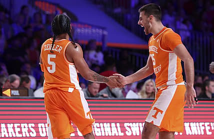 Nov 25, 2022; Paradise Island, BAHAMAS; Tennessee Volunteers guard Santiago Vescovi (25) celebrates with Tennessee Volunteers guard Zakai Zeigler (5) during the second half against the Kansas Jayhawks at Imperial Arena. Mandatory Credit: Kevin Jairaj-USA TODAY Sports