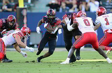 Sep 18, 2021; Carson, California, USA; San Diego State Aztecs running back Greg Bell (22) runs the ball against the Utah Utes during the first half at Dignity Health Sports Park. Mandatory Credit: Gary A. Vasquez-USA TODAY Sports