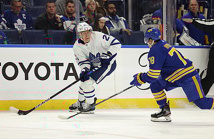 Nov 13, 2021; Buffalo, New York, USA;  Toronto Maple Leafs right wing Ondrej Kase (25) looks to make a pass as Buffalo Sabres defenseman Jacob Bryson (78) defends during the first period at KeyBank Center. Mandatory Credit: Timothy T. Ludwig-USA TODAY Sports