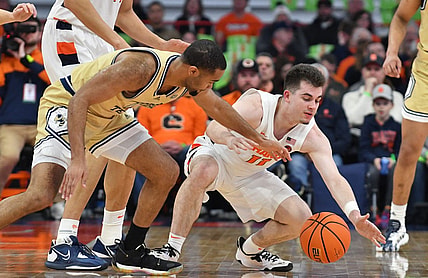 Feb 28, 2023; Syracuse, New York, USA; Syracuse Orange guard Joseph Girard III (11) and Georgia Tech Yellow Jackets guard Kyle Sturdivant (1) go for a loose ball in the first half at the JMA Wireless Dome. Mandatory Credit: Mark Konezny-USA TODAY Sports
