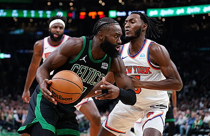 Nov 13, 2023; Boston, Massachusetts, USA; Boston Celtics guard Jaylen Brown (7) drives the ball against New York Knicks guard Immanuel Quickley (5) in the first quarter at TD Garden. Mandatory Credit: David Butler II-USA TODAY Sports