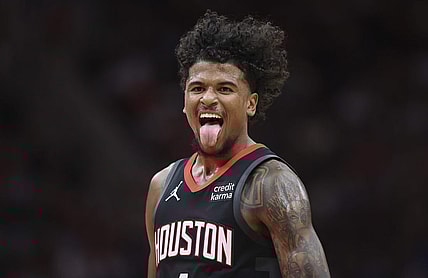 Mar 14, 2024; Houston, Texas, USA; Houston Rockets guard Jalen Green (4) reacts after making a basket during the third quarter against the Washington Wizards at Toyota Center. Mandatory Credit: Troy Taormina-USA TODAY Sports