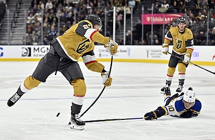 St. Louis Blues center Brayden Schenn (10) breaks up a shot by Vegas Golden Knights defenseman Shea Theodore, left, during the second period of an NHL hockey game Monday, Jan. 20, 2025, in Las Vegas. (AP Photo/David Becker)