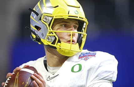 Jan 2, 2021; Glendale, AZ, USA;   Oregon quarterback Tyler Shough (12) throws passes before the Fiesta Bowl game against Iowa State at State Farm Stadium.  Mandatory Credit: Patrick Breen-USA TODAY Sports