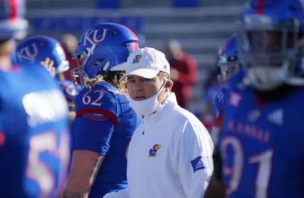 Oct 31, 2020; Lawrence, Kansas, USA; Kansas Jayhawks head coach Les Miles watches team warm ups before the game against the Iowa State Cyclones at David Booth Kansas Memorial Stadium. Mandatory Credit: Denny Medley-USA TODAY Sports