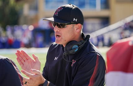 Oct 16, 2021; Lawrence, Kansas, USA; Texas Tech Red Raiders head coach Matt Wells celebrates with players against the Kansas Jayhawks during the first half at David Booth Kansas Memorial Stadium. Mandatory Credit: Denny Medley-USA TODAY Sports