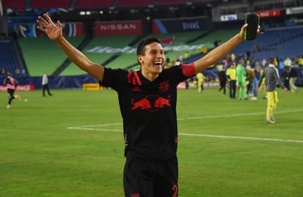 Nov 7, 2021; Nashville, Tennessee, USA; New York Red Bulls midfielder Sean Davis (27) celebrates after a draw against the Nashville SC at Nissan Stadium. Mandatory Credit: Christopher Hanewinckel-USA TODAY Sports