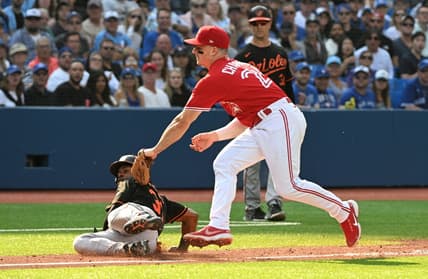 Sep 17, 2022; Toronto, Ontario, CAN;  Toronto Blue Jays third baseman Matt Chapman (26) tags out Baltimore Orioles center fielder Cedric Mullins after a rundown in the fourth inning at Rogers Centre. Mandatory Credit: Dan Hamilton-USA TODAY Sports
