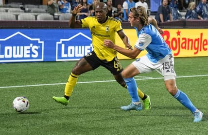Jul 30, 2022; Charlotte, North Carolina, USA; Columbus Crew midfielder Darlington Nagbe (6) and Charlotte FC midfielder Benjamin Bender (15) chase down the ball during the first half at Bank of America Stadium. Mandatory Credit: Jim Dedmon-USA TODAY Sports