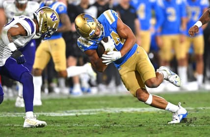 Sep 30, 2022; Pasadena, California, USA; UCLA Bruins running back Zach Charbonnet (24) goes for a first down in the first half against the Washington Huskies at the Rose Bowl. Mandatory Credit: Jayne Kamin-Oncea-USA TODAY Sports