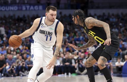 Nov 2, 2022; Dallas, Texas, USA;  Dallas Mavericks guard Luka Doncic (77) controls the ball as Utah Jazz guard Jordan Clarkson (00) defends during the second quarter at American Airlines Center. Mandatory Credit: Kevin Jairaj-USA TODAY Sports