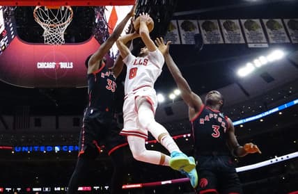 Nov 7, 2022; Chicago, Illinois, USA; Toronto Raptors forward Christian Koloko (35) forward O.G. Anunoby (3) defends Chicago Bulls guard Zach LaVine (8) during the second half at United Center. Mandatory Credit: David Banks-USA TODAY Sports